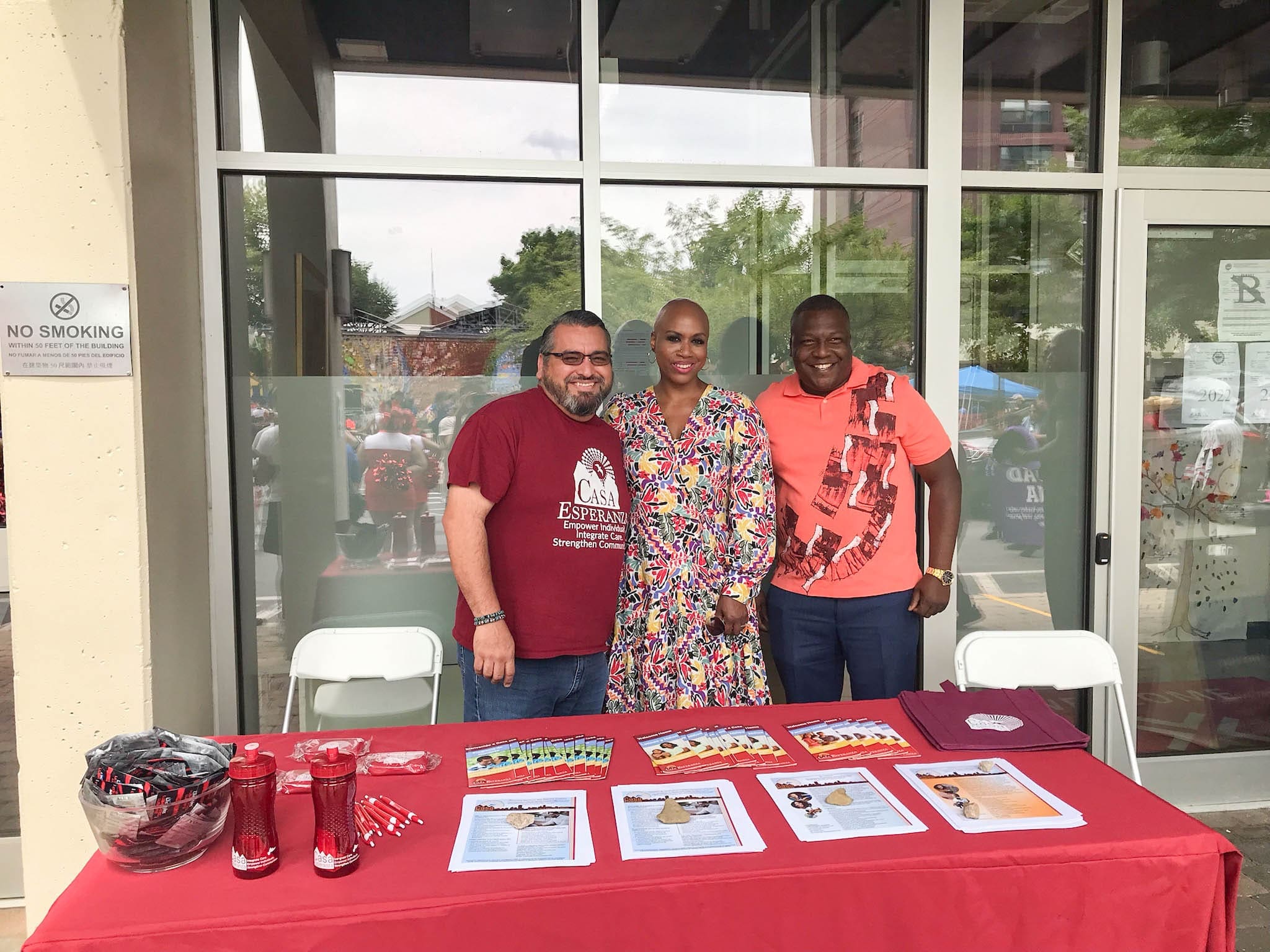 Casa Esperanza employees staffing a booth at a community event, representing our commitment to empowering wellness and recovery through behavioral health services.