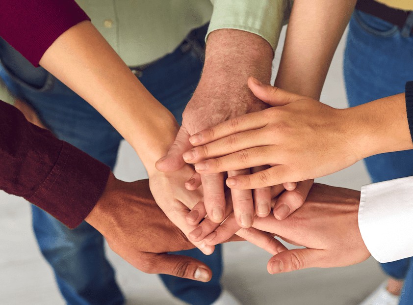 Diverse hands representing support and teamwork